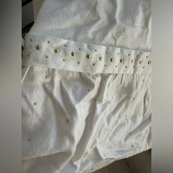 Chloe white dress with gold studs. Size 9 months. Chloe white dress with gold studs. Size 9 months.